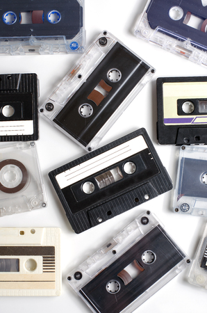 Old audio cassettes on white background. Flat top view. Vertical photoの写真素材