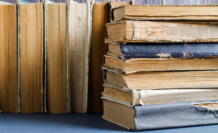 Old books with crumpled, torn covers. Close upの写真素材