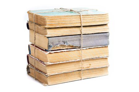 Old books with crumpled, torn covers. Tied with ropeの写真素材