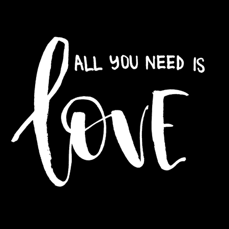 All you need is love. White inscription on a black background. Handwritten text. Modern calligraphy. Inspirational quote.の写真素材