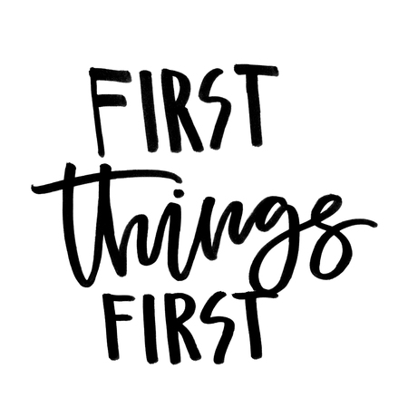 First things first. Handwritten text. Modern calligraphy. Isolated on whiteの写真素材
