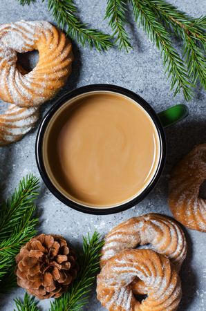Hot chocolate in a metal mug. Green Christmas tree branches, pine cones. Flat Layの写真素材