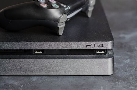 IZHEVSK, RUSSIA - 17 OCTOBER, 2019: PlayStation game console with black joystick