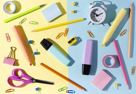 Children's accessories for study, creativity and office supplies on a colored paper background. Back to school concept.の写真素材