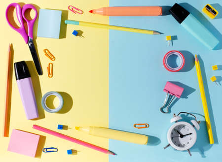 Childrens accessories for study, creativity and office supplies on a colored paper background. Back to school concept. Copy space.の写真素材