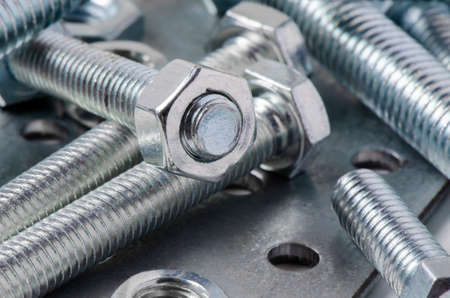 Metal bolts and nuts. Tools for working and fixing. Macrophotography