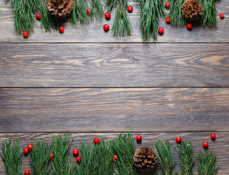 Christmas composition on a brown wooden background. Flat lay, top view, copy spaceの写真素材