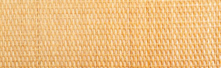 Yellow rattan texture. Copy space. Close upの写真素材