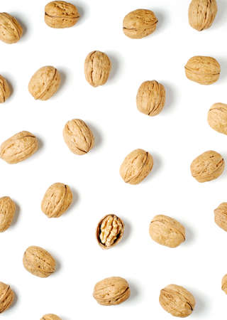 Walnuts on a white background. Nut - a source of vitamins and useful trace elements. Flat top view.