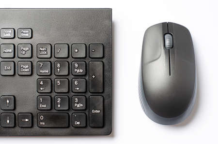 Computer mouse and keyboard on a white background.