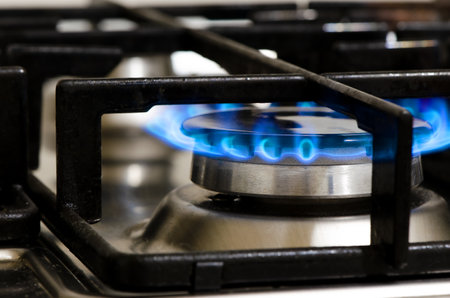 A burning gas stove. The use of natural gas at home and in the kitchen.