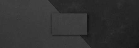 Black rectangular mockups on a dark concrete background. Design elements or portfolio. Copy space.の写真素材