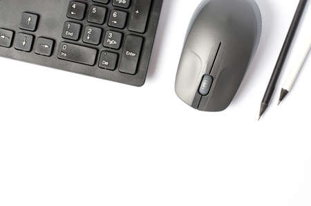 Computer mouse and keyboard on a white background. Copy spaceの写真素材