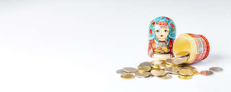 Traditional Russian toy matryoshka and money. White background. Copy spaceの写真素材