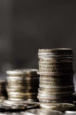 Lots of coins. The concept of investing or saving money or a financial crisis. Copy space