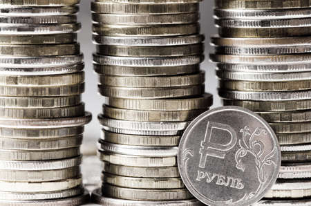 Lots of coins. The concept of investing or saving money or a financial crisisの写真素材