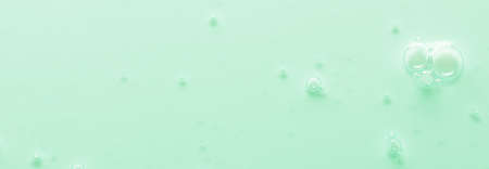 Cosmetic serum or body gel. Textured background with bubbles. Copy spaceの写真素材