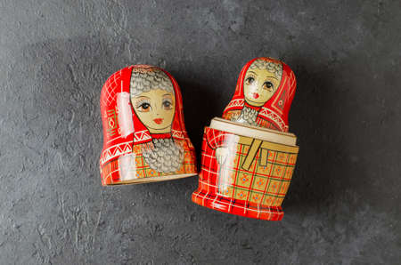 A red matryoshka doll on a black background. Traditional Russian toy.の写真素材
