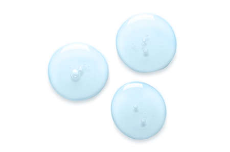 Blue drops of gel closeup. Cosmetic product for skin care. Isolated on whiteの写真素材