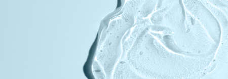 Transparent cosmetic texture. Skin serum or washing gel. Macrophotography. Copy space.