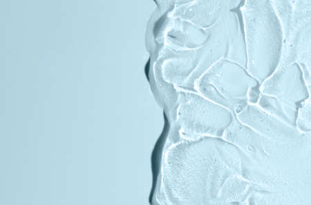 Transparent cosmetic texture. Skin serum or washing gel. Macrophotography. Copy space.