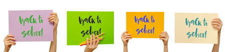Colored posters in the girls hand. Set. Handwritten inscription Back to school. Isolated on white