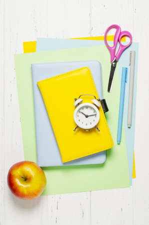 Childrens accessories for study, creativity and office supplies on a white wooden background. Back to school concept. Copy spaceの写真素材