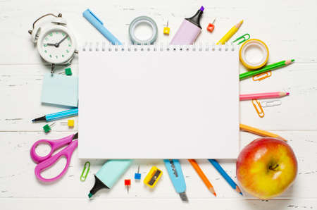 Childrens accessories for study, creativity and office supplies on a white wooden background. Back to school concept. Copy spaceの写真素材