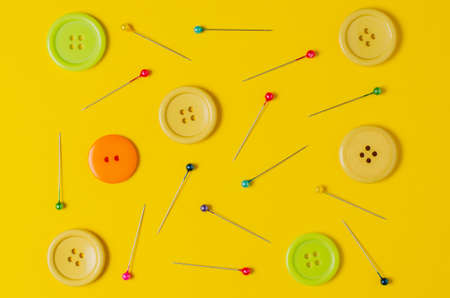 Sewing accessories on a yellow background. Closeup.の写真素材