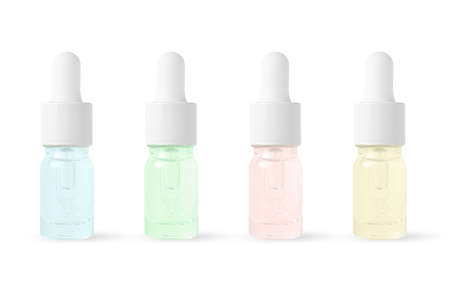 Cosmetic product in a bottle with a pipette. Serum for skin or hair. Isolated on a white backgroundの写真素材