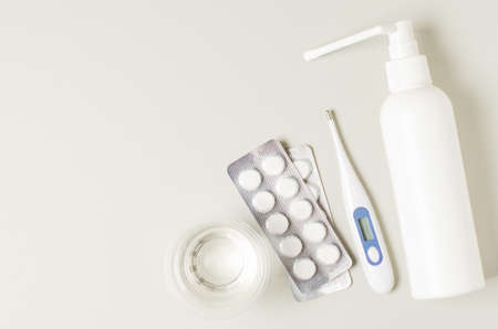 Medical electronic thermometer, nasal spray and tablets. The concept of diagnosis and treatment of a...
