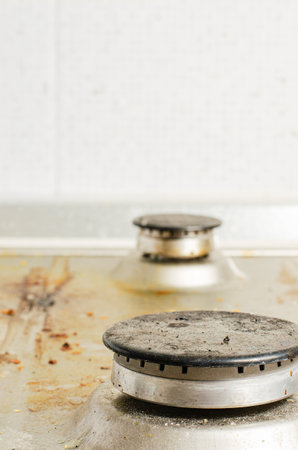 Dirty gas stove. The concept of cleaning in the kitchenの写真素材