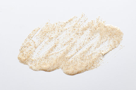 Sample cream scrub for washing with vitamin F. An exfoliating skin care product. White backgroundの写真素材