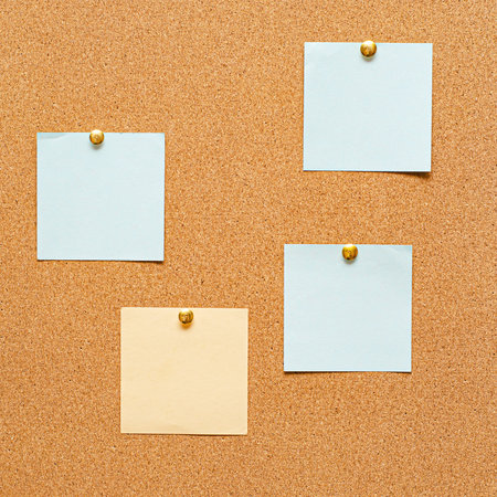 Blank paper notes are pinned to a cork board. The concept of detective investigation or training. Copy space.の写真素材