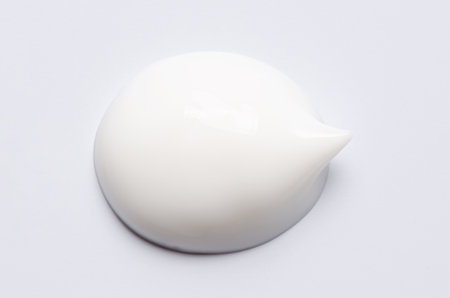 A sample of a white moisturizing cosmetic cream for the body or face