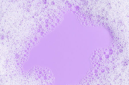 Texture of white foam. Cleansing mousse for the face or bath foam or washing powder. Copy space