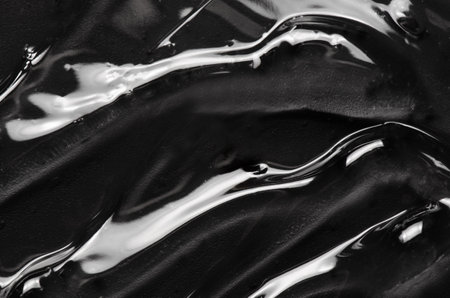 Transparent cosmetic moisturizing gel or skin serum on a black backgroundの写真素材