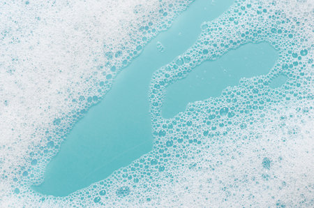 Texture of white foam. Cleansing mousse for the face or bath foam.