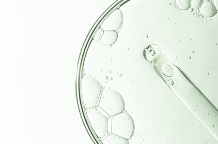 Cosmetic moisturizing gel or skin serum in a petri dish. Copy space.