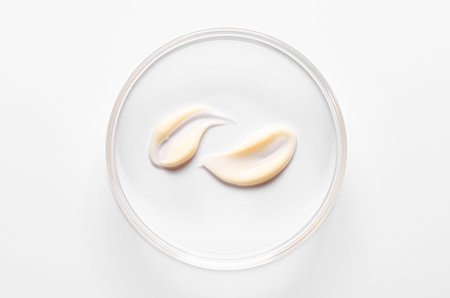 A sample of moisturizing or anti-aging cream in a petri dish