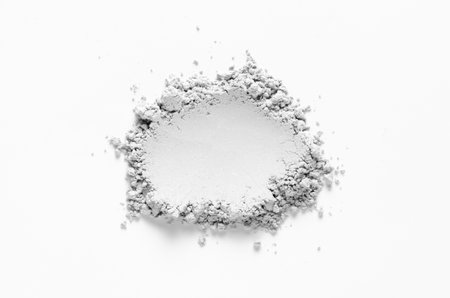 A sample of dry cosmetic clay for a skin mask. White background.の写真素材