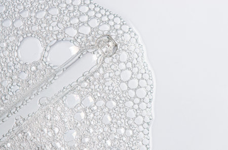 The texture of the foam of shower gel or soap suds or shaving foam. Macrophotographyの写真素材