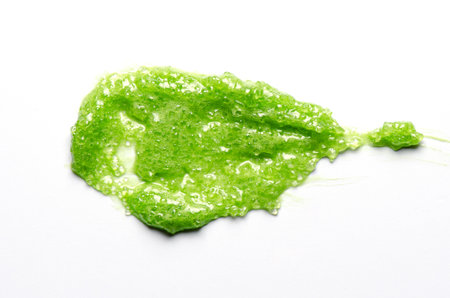 A sample of a cosmetic body care scrub. White background.の写真素材