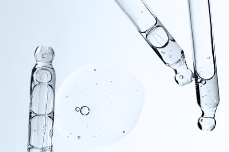 Skin serum in a pipette. A cosmetic product for body care. White background. Copy space.の写真素材