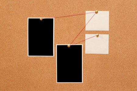 Blank paper notes and an empty photo are pinned to a cork board. The concept of detective...