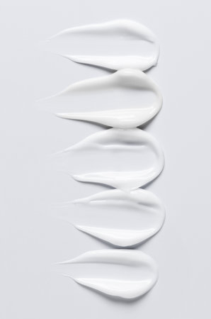 A sample of a white moisturizing cosmetic cream for the body or face with hyaluronic acidの写真素材