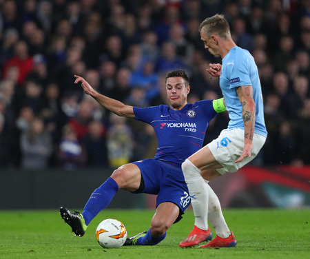 LONDON, ENGLAND - FEBRUARY 21: Cesar Azpilicueta of Chelsea and Oscar Lewicki of Malmo compete for the ball during the Europa League Round of 32, second leg match between Chelsea and Malmo FF at Stamford Bridge on February 21 2019 in London, United Kingdoのeditorial素材