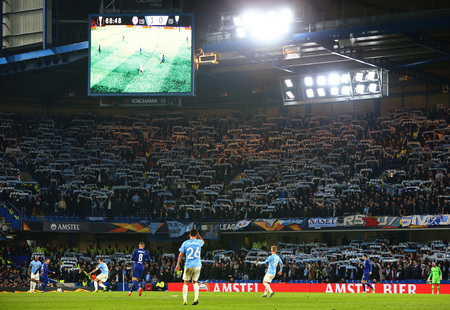 LONDON, ENGLAND - FEBRUARY 21: A general view as Malmo fans hold aloft their scarves during the Europa League Round of 32, second leg match between Chelsea and Malmo FF at Stamford Bridge on February 21 2019 in London, United Kingdom.のeditorial素材