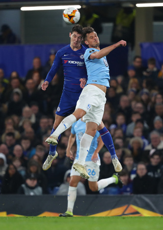 LONDON, ENGLAND - FEBRUARY 21: Andreas Christensen of Chelsea and Markus Rosenberg of Malmo compete for the ball during the Europa League Round of 32, second leg match between Chelsea and Malmo FF at Stamford Bridge on February 21 2019 in London, United Kのeditorial素材
