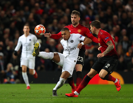 MANCHESTER, ENGLAND - FEBRUARY 12 2019: Luke Shaw of Manchester United  and Kylian Mbappe of PSG during the Champions League match between Manchester United and Paris Saint-Germain at Old Trafford Stadium.のeditorial素材